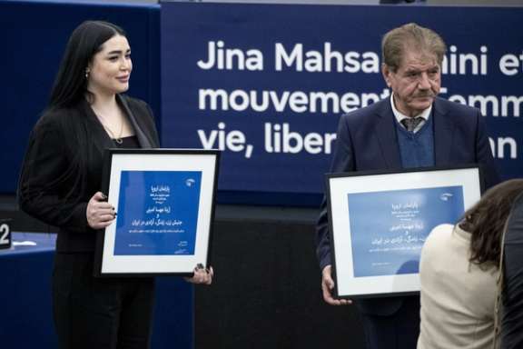 Afsoon Najafi (left), the sister of slain protester Hadis Najafi, and Saleh Nikbakht, the lawyer of Mahsa Amini's family during the European Parliament Sakharov Prize ceremony in Strasbourg, eastern France, December 12, 2023