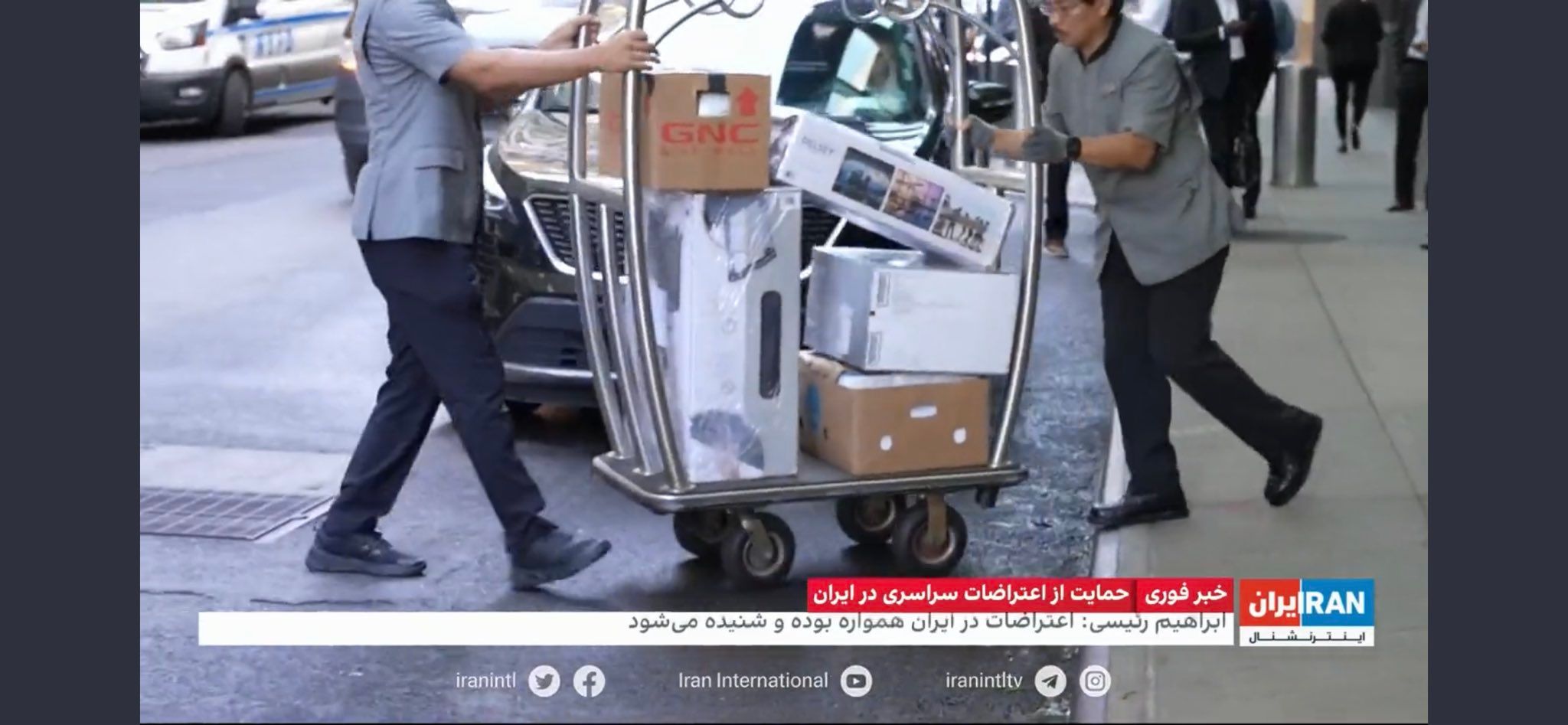Trolleys of luggage belonging to Iran’s President Ebrahim Raisi’s entourage being loaded on a truck in front of the Millennium Hilton hotel in New York on September 23, 2022 