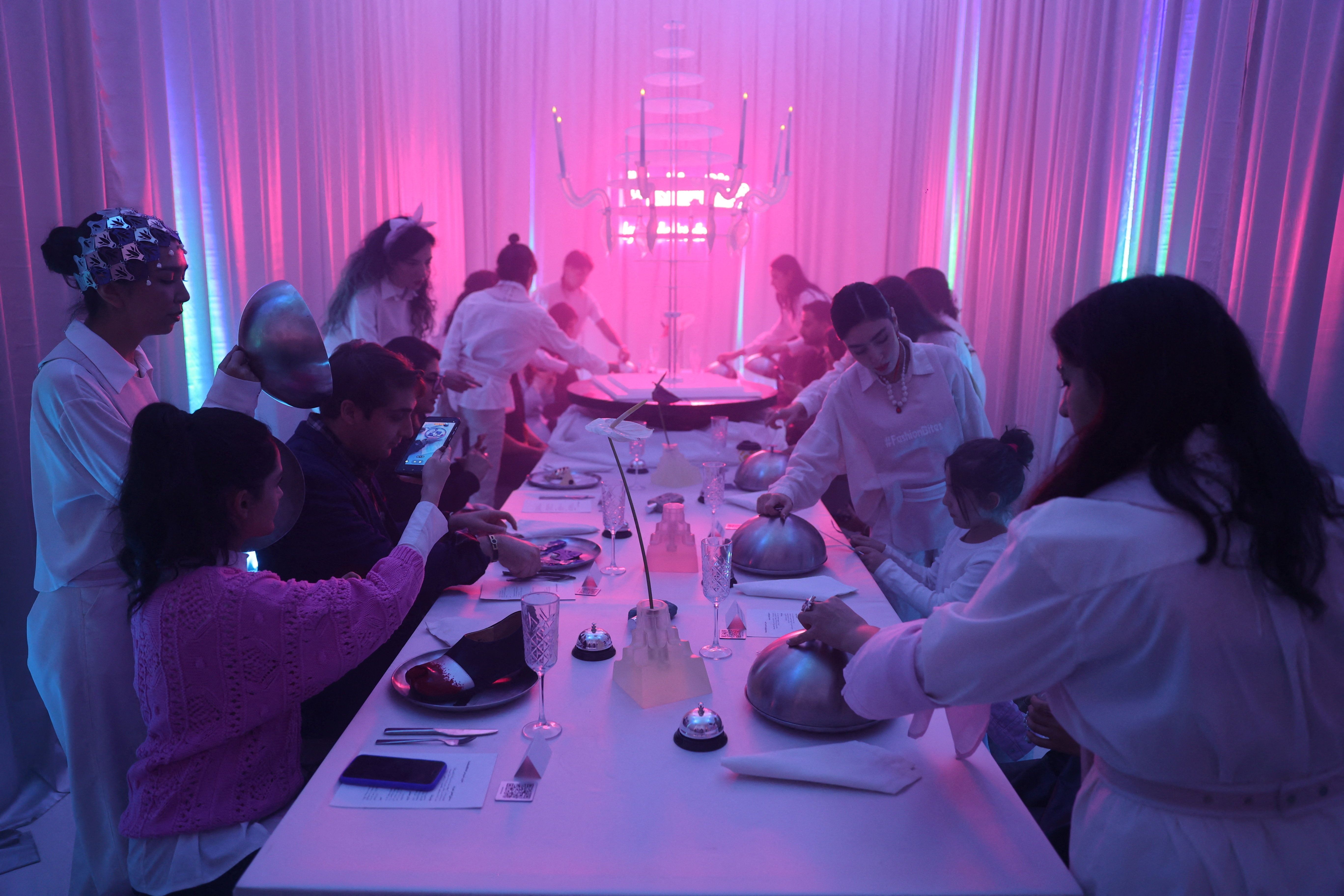 Iranian women visit the Tehran Design Week event in a gallery in Tehran, Iran, November 16, 2025. 