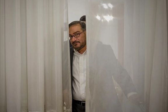 Iranian ex-security chief Ali Shamkhani is pictured between curtains in this file photo.