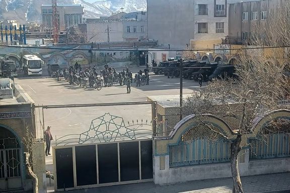 Security forces gather in a school courtyard during the January protests in Iran.