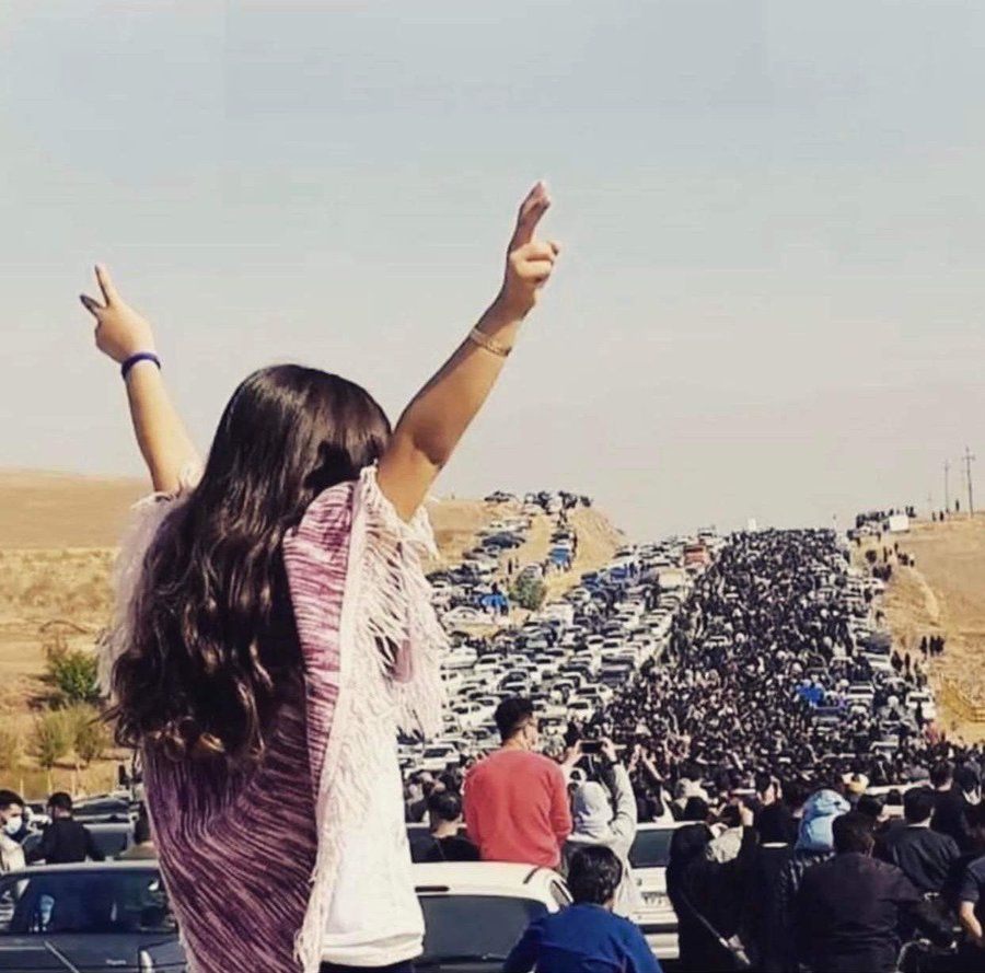 A procession of people paying respect to Mahsa Amini on the 40th day of her death in her hometown on October 26, 2022