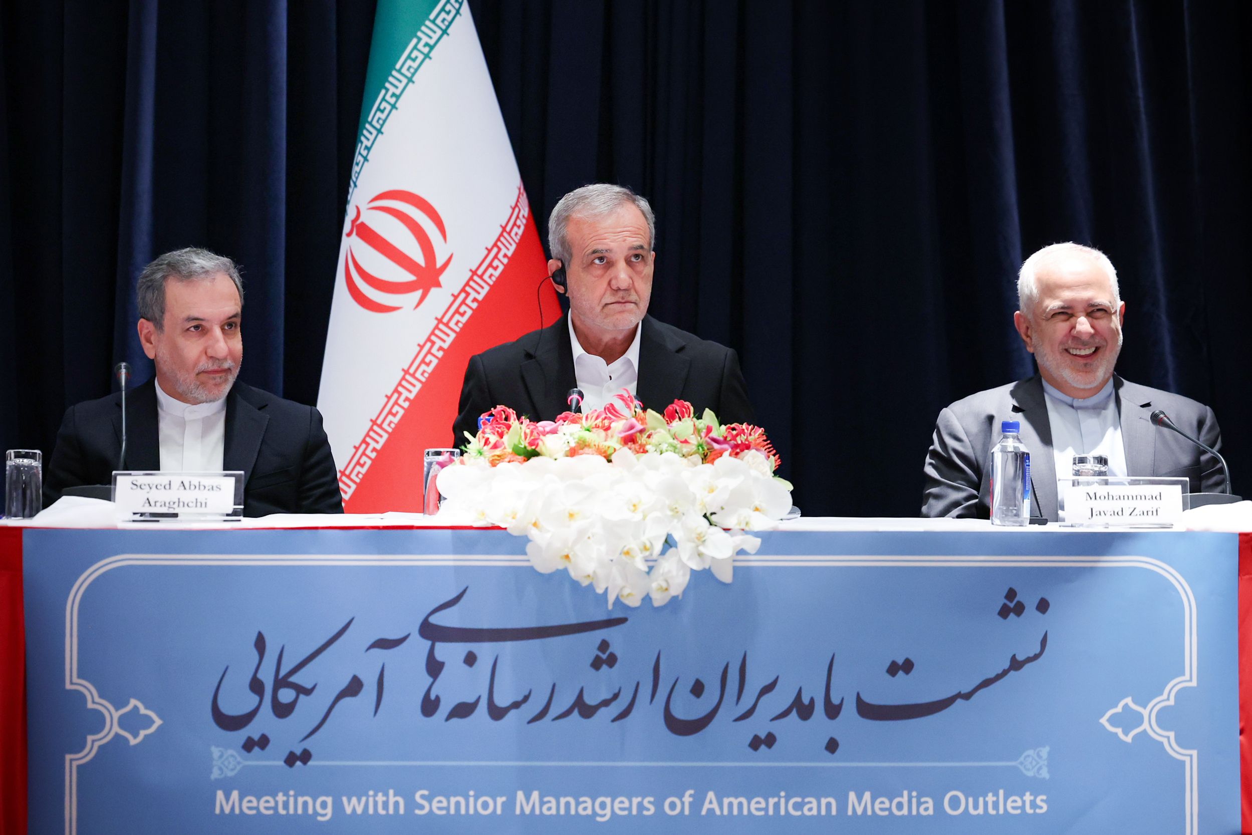 Iranian President Masoud Pezeshkian (center) and Foreign Minister Abbas Araghchi (left) and Mohammad Javad Zarif, an advisor to the president, during a meeting with a group of representatives of US media outlets in New York, September 23, 2024 