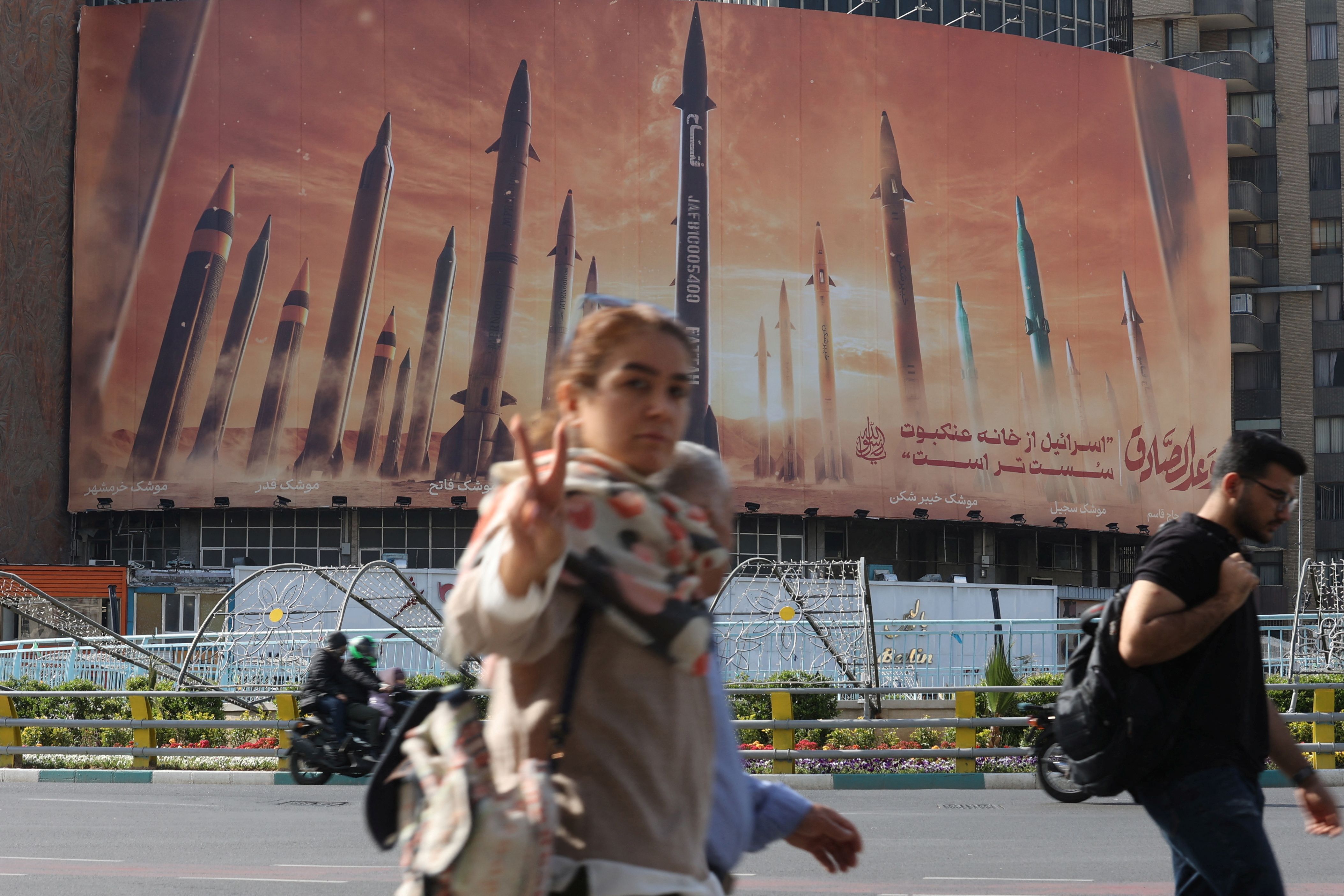 An anti-Israel billboard with a picture of Iranian missiles is seen in a street in Tehran, Iran April 15, 2024. 