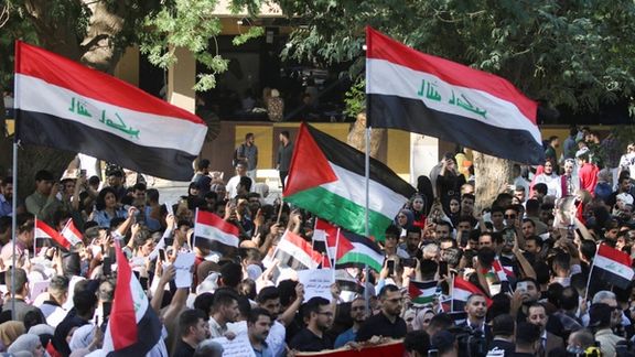 Iraqis students gather during a protest in support of Palestinians in Gaza, Baghdad, October 18, 2023.