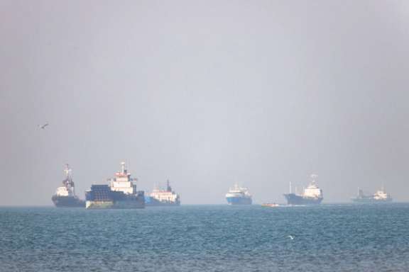 Ships sail near the Strait of Hormuz, where tanker attacks on Tuesday prompted the United States to revoke a short-lived authorization for Iranian oil sales.