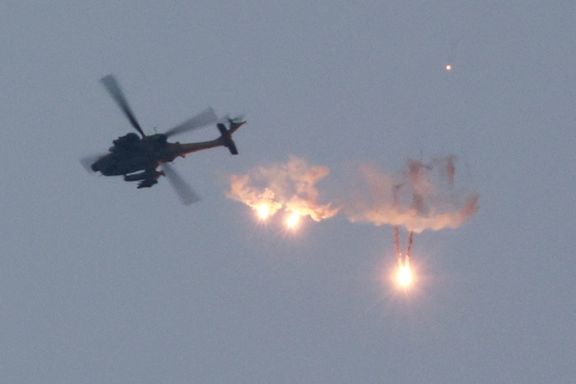 An Apache helicopter fires flares, amid the ongoing conflict between Israel and Palestinian Islamist group Hamas, as seen from Sderot in southern Israel, November 1, 2023.