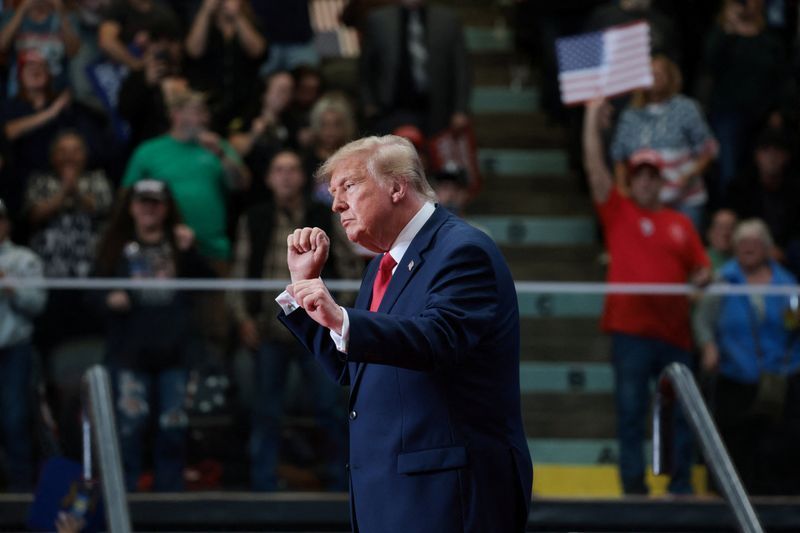 US President Donald Trump dances during a rally, in support of Republican US Senate candidate, former US Representative Mike Rogers, ahead of the midterm elections, at an entertainment complex in Port Huron, Michigan, US, October 25, 2026. REUTERS/Jonathan Ernst