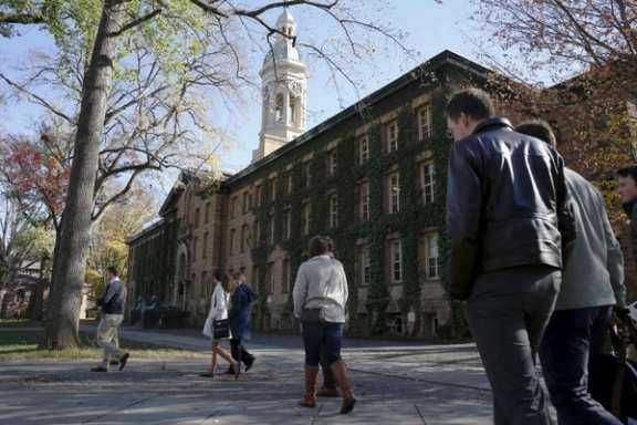 People walk past Princeton University's Nassau Hall in Princeton, New Jersey.