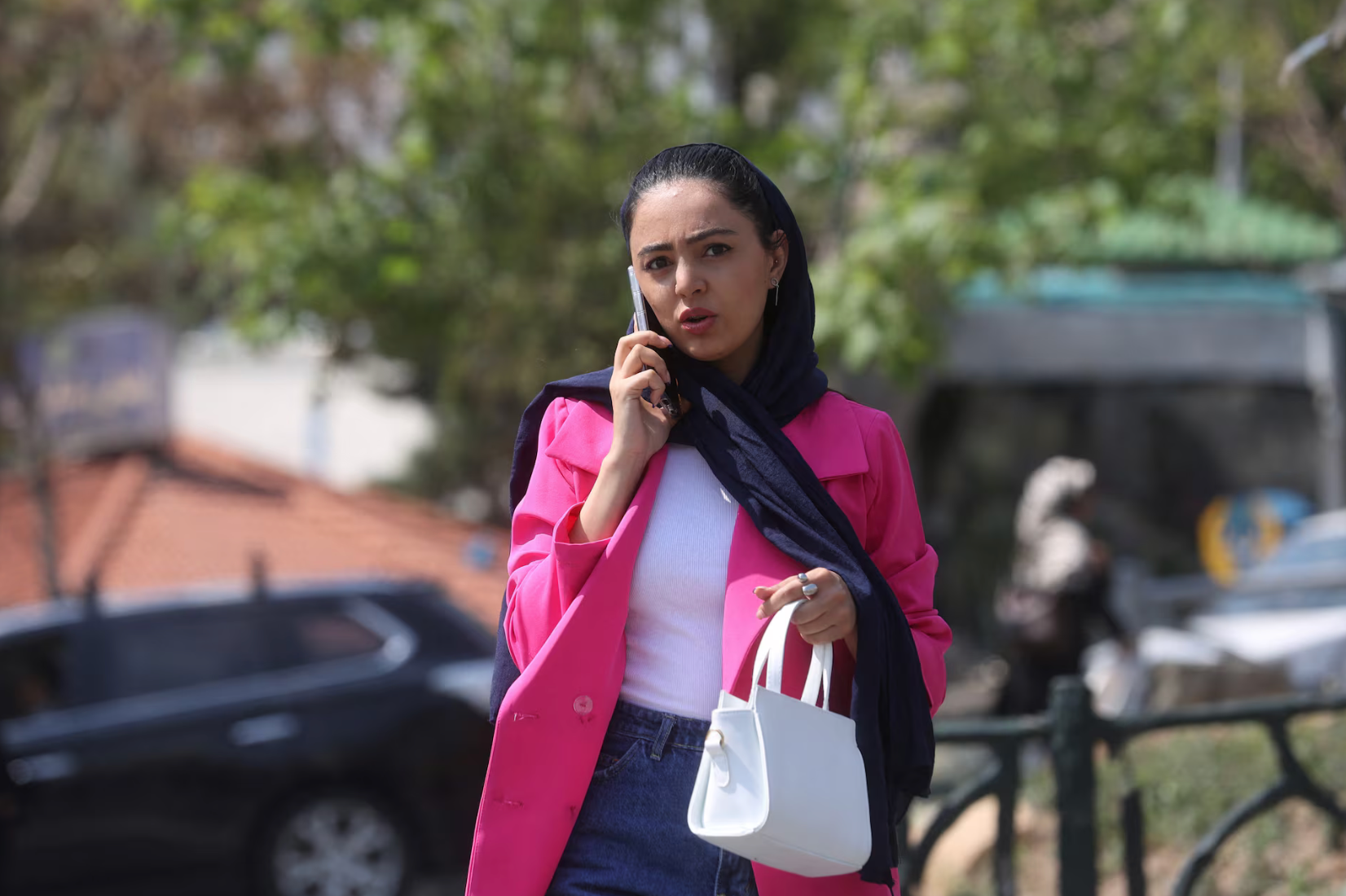 An Iranian woman walks on a street amid the implementation of the new hijab surveillance in Tehran, Iran, April 15, 2023.