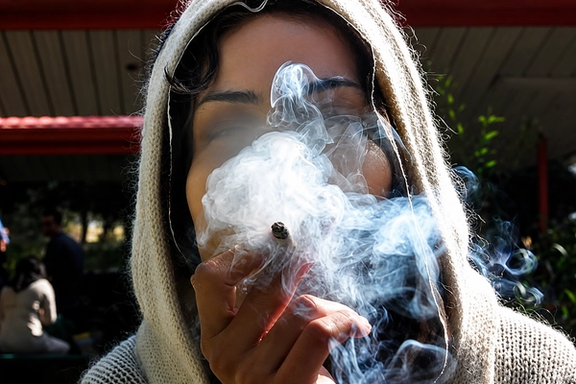 A woman smokes a cannabis cigarette in Iran in this undated file photo.