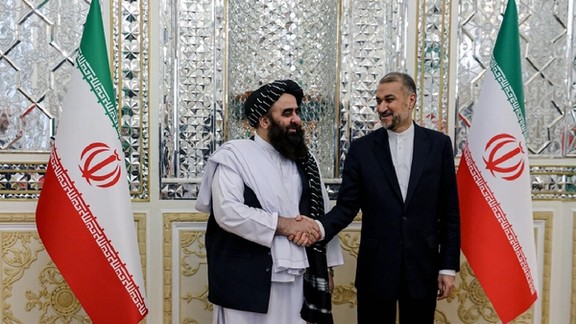 Taliban's Foreign Minister Amir Khan Muttaqi (left) and his Iranian counterpart Hossein Amir-Abdollahian in Tehran (December 2023)