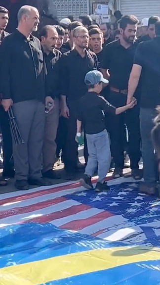 Mourners In Iran Refuse To Trample On Swedish, American Flags