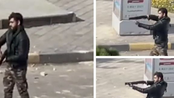 A security officer firing at protesters in Esfahan in Noveber 2021