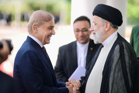 Pakistan's Prime Minister Shehbaz Sharif greets Iranian President Ebrahim Raisi on his three-day official visit in Islamabad, Pakistan April 22, 2024.