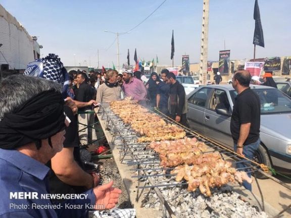 Free food is served to pilgrims of Arbaeen along the route to the Iraqi city of Karbala