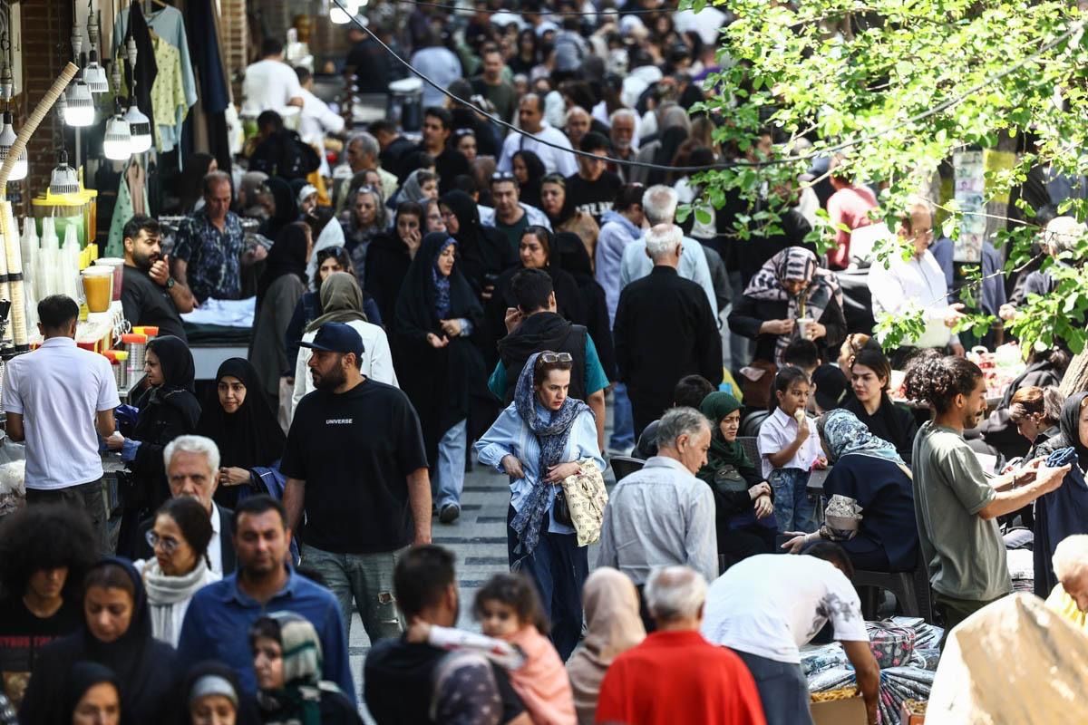 People walk in Tehran's Grand Bazaar, April 21, 2026