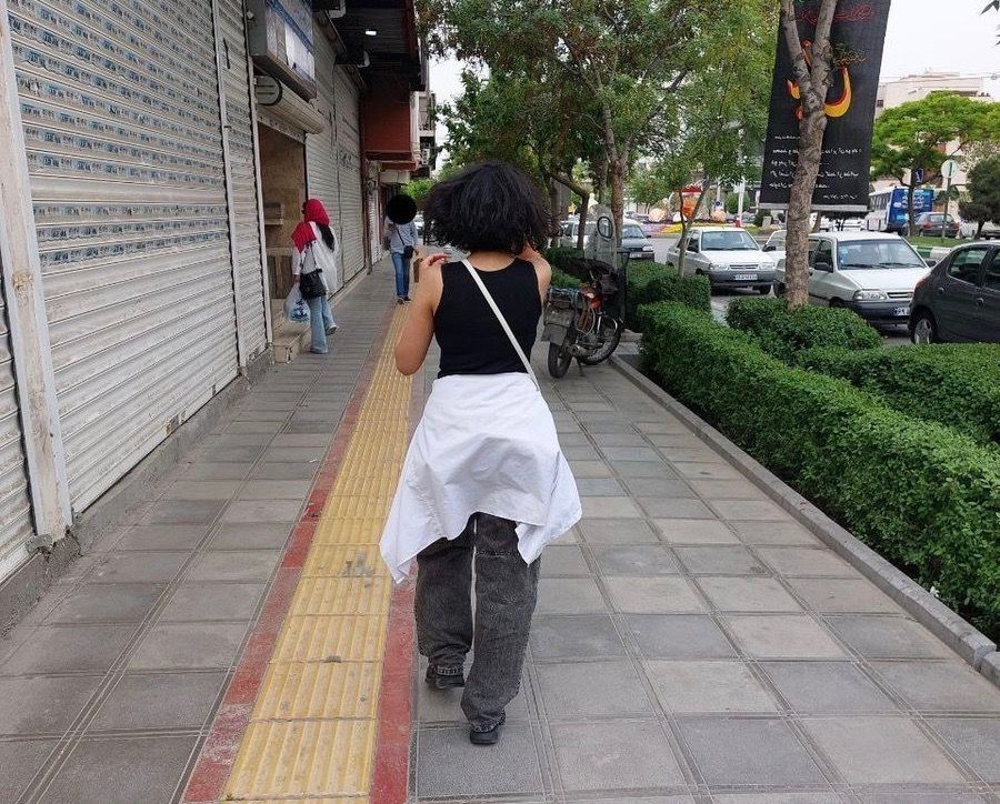 A girl on a street in the religious city of Mashhad (undated)