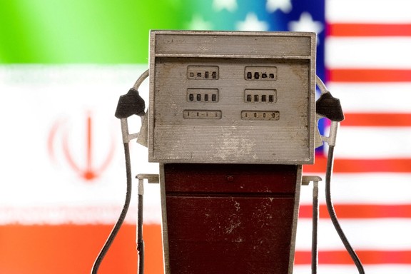 Model of petrol pump is seen in front of US and Iran flag colors in this illustration taken March 25, 2022.