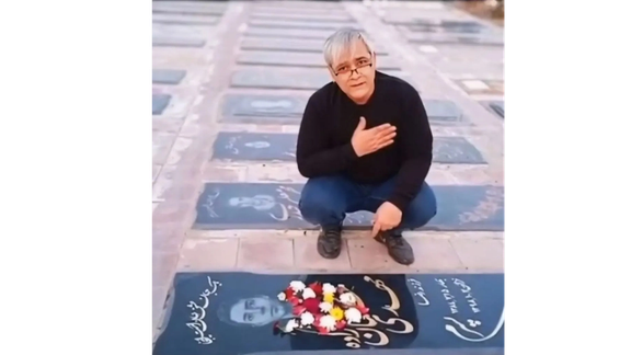 Reza Salmanzadeh at his son Mehdi Salmanzaeh's burying place