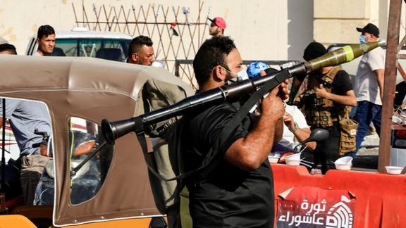 A Sadrist fighter with an RPG in Baghdad on Monday, while wearing a COVID mask. August 30, 2022