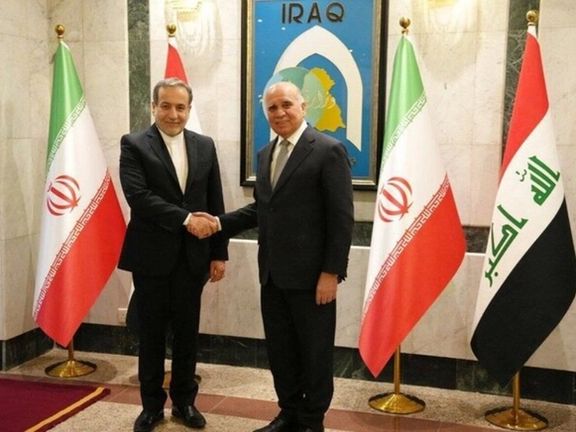 Iran's Foreign Minister Abbas Araghchi (left) and his Iraqi counterpart Fuad Hussein at Iraq’s Foreign Ministry’s headquarters in Baghdad, October 13, 2024