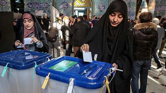 People casting votes in an election in Iran