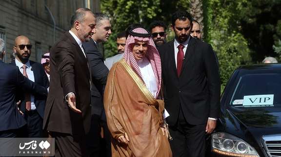Iran's Foreign Minister Hossein Amir Abdollahian greeting Saudi counterpart Faisal Bin Farhan in Tehran's Foreign Ministry building, June 17, 2023