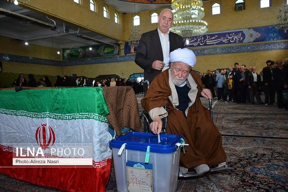 A cleric casting his vote during the parliamentary elections in the city of Qazvin in March 2020