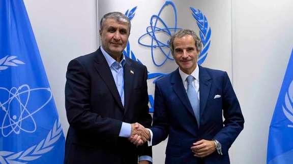 Head of the Atomic Energy Organization of Iran Mohammad Eslami (left) and the International Atomic Energy Agency Director General Rafael Mariano Grossi in Vienna on September 25, 2023
