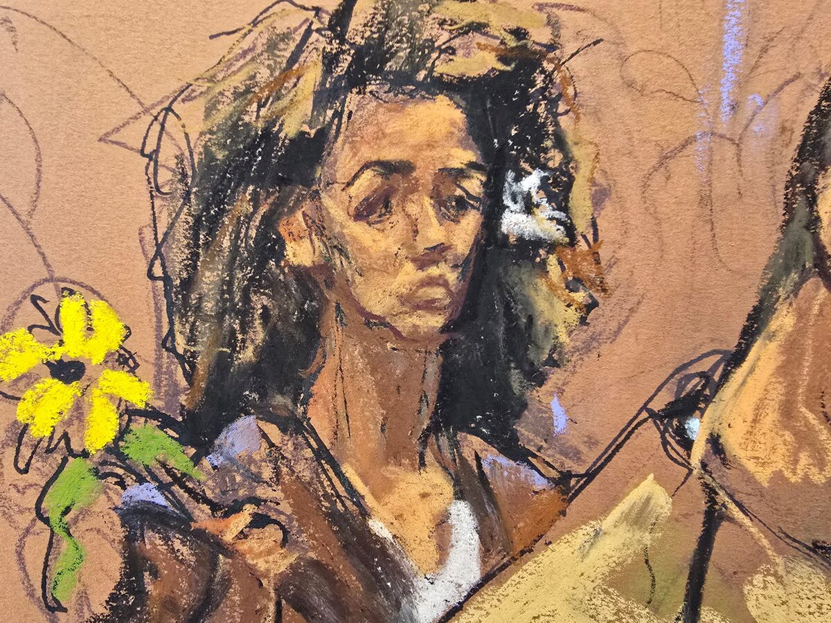 Prominent New York-based dissident and journalist Masih Alinejad holds a sunflower during the sentencing of Polad Omarov and Radar Amirov, who were convicted of involvement in an unsuccessful Iran-backed plot to kill her, at federal court in New York, October 29, 2025 in this courtroom sketch.