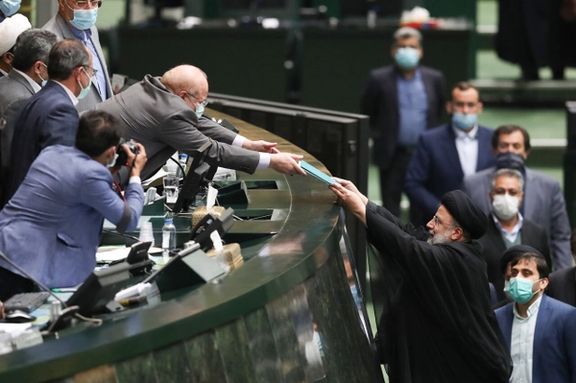 President Ebrahim Raisi handing over the draft budget to Parliament Speaker Ghalibaf on December 12, 2021