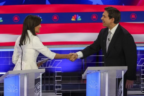 Former South Carolina Governor Nikki Haley and Florida Governor Ron DeSantis shake hands at the conclusion of the broadcast at the third Republican candidates' presidential debate in Miami, Florida, November 8, 2023.