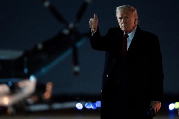 US President Donald Trump gestures as he arrives at Joint Base Andrews in Maryland, April 13, 2025.