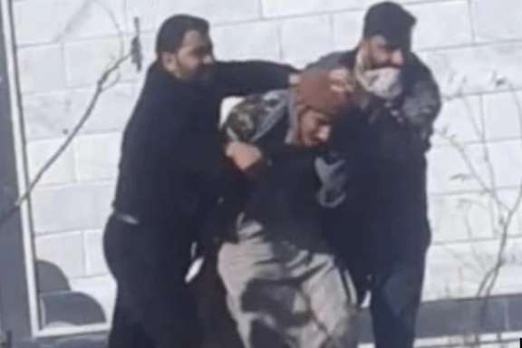 Plainclothes agents arresting a protester in Zahedan on January 27, 2023