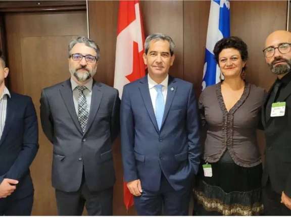 Canada’s Justice Minister and Attorney General Arif Virani (center) and several Iranian activists
