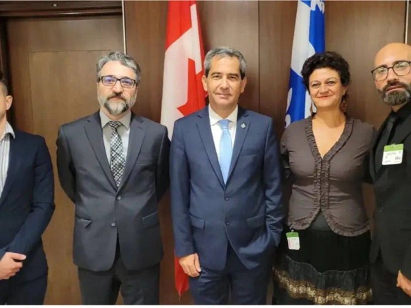 Canada’s Justice Minister and Attorney General Arif Virani (center) and several Iranian activists