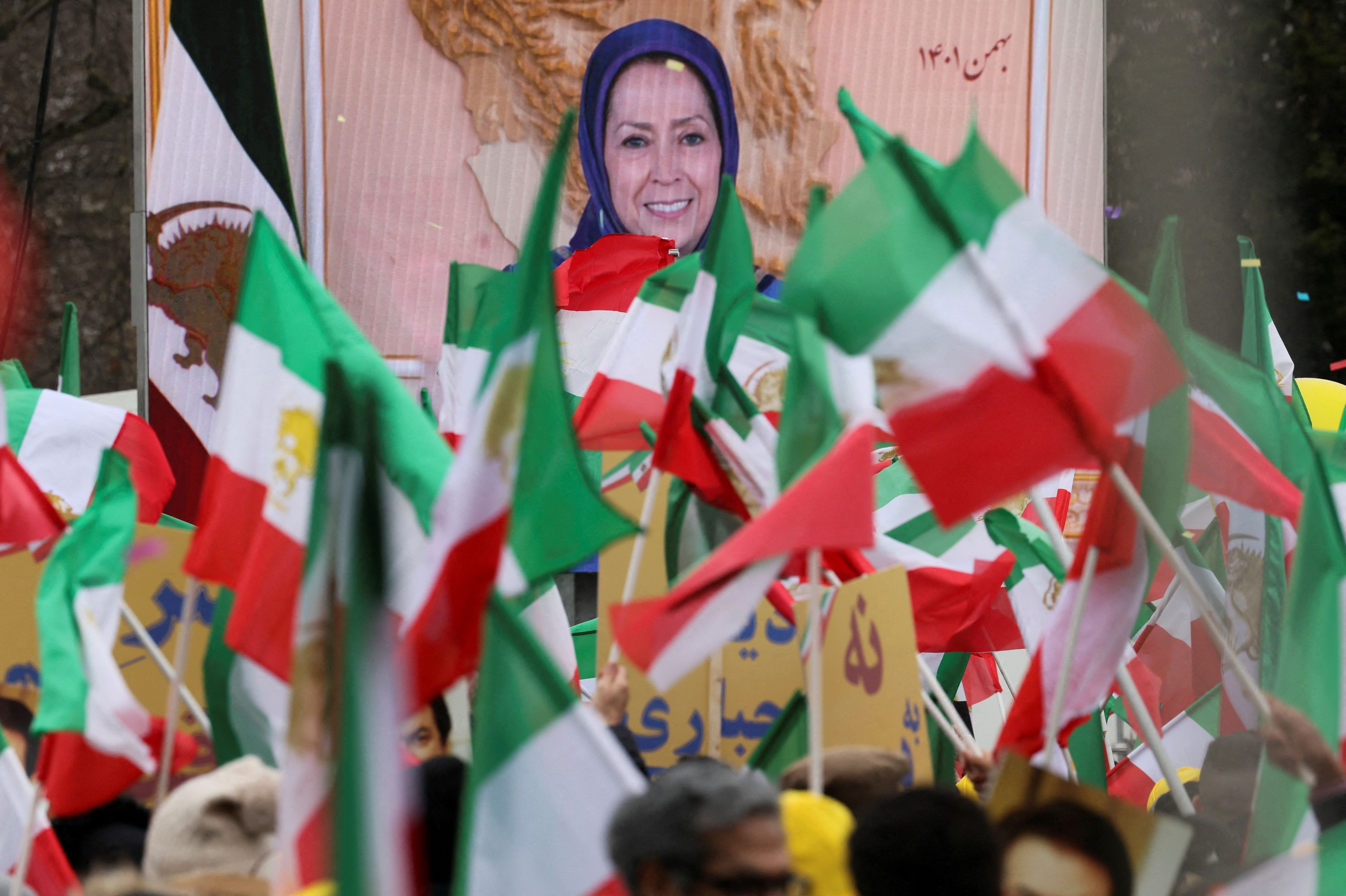 Maryam Rajavi, leader of the National Council of Resistance of Iran (NCRI) opposition group, is seen speaking on a screen as supporters rally in solidarity with protesters in Iran, in Paris, France, February 12, 2023. 