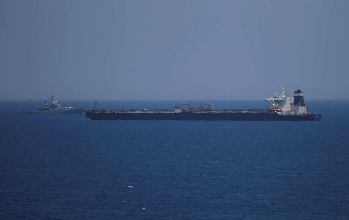 A British Royal Navy patrol vessel guards the oil supertanker Grace 1, that's on suspicion of carrying Iranian crude oil to Syria, as it sits anchored in waters of the British overseas territory of Gibraltar, historically claimed by Spain, July 4, 2019. 