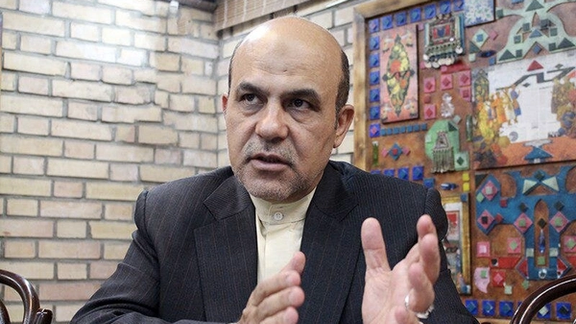 Alireza Akbari in an undated photo during an interview in Tehran