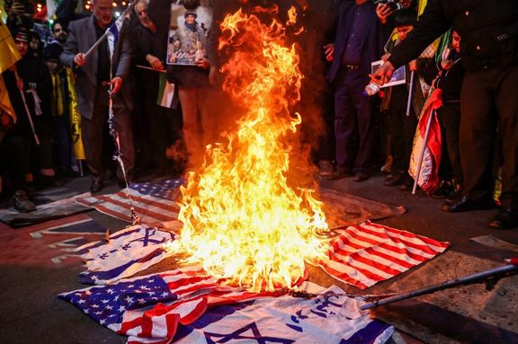 A crowd sets fire to Israeli and American flags, Tehran, Iran, March 5, 2024