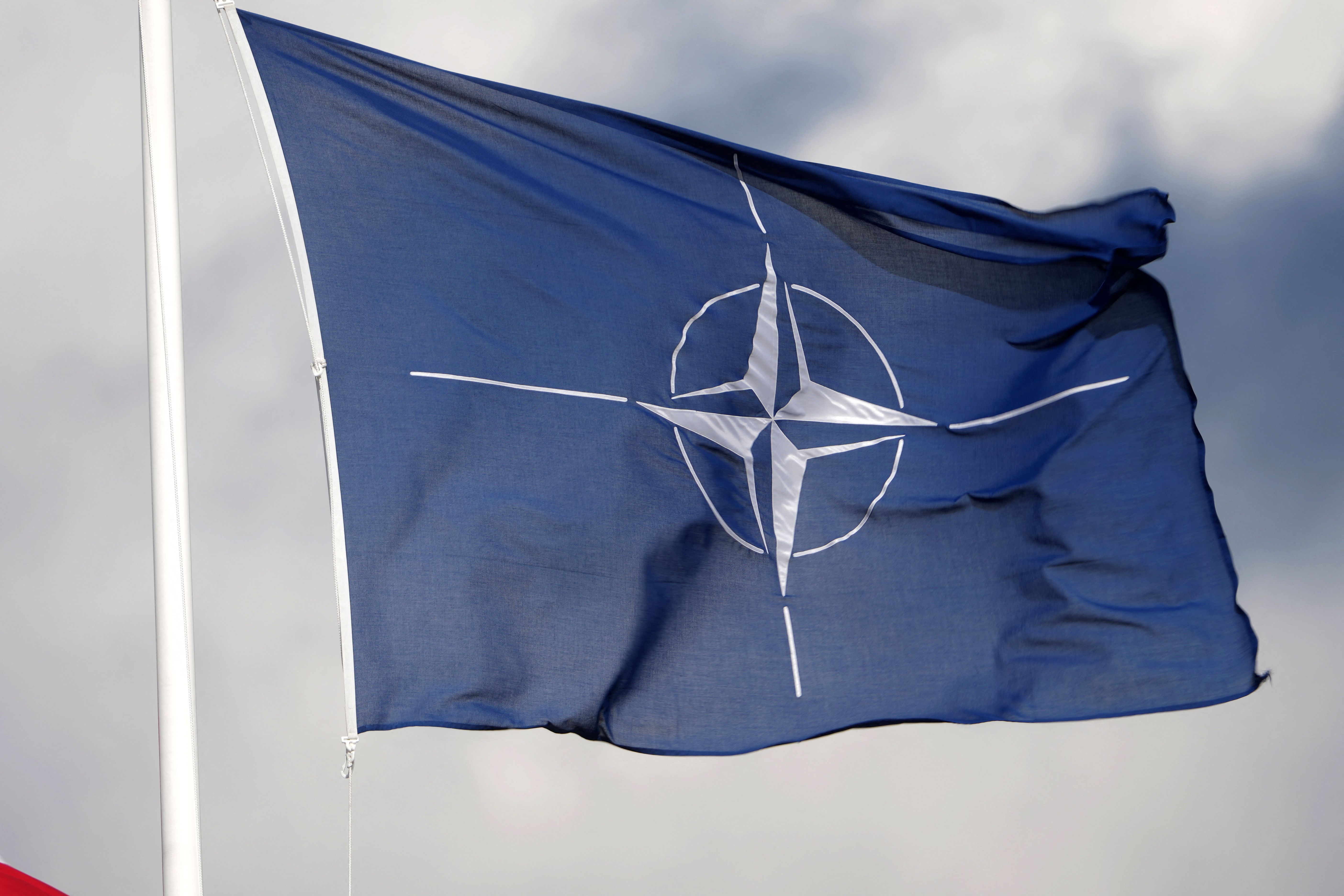 A NATO flag flutters at the Tapa military base, Estonia April 30, 2023. 