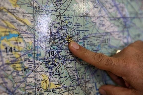 Gen. Masoud Rouzkhosh pointing at Shekari Air Base's location on the map (undated)