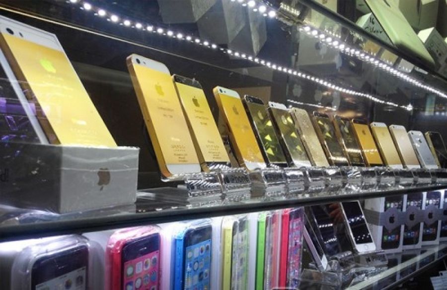 Apple iPhones on display on shelves in Tehran.