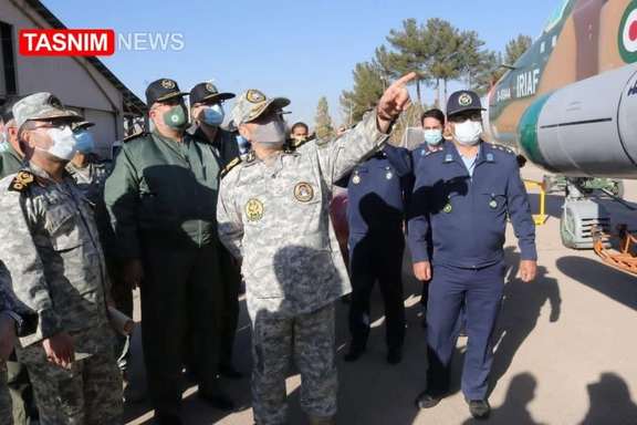 Photo published by Tasnim news agency showing Iranian officers looking at a Sukhoi 24 warplane allegedly fitted with a cruise missile.