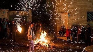 Young Iranians turn ancient bonfire festival into night of defiance