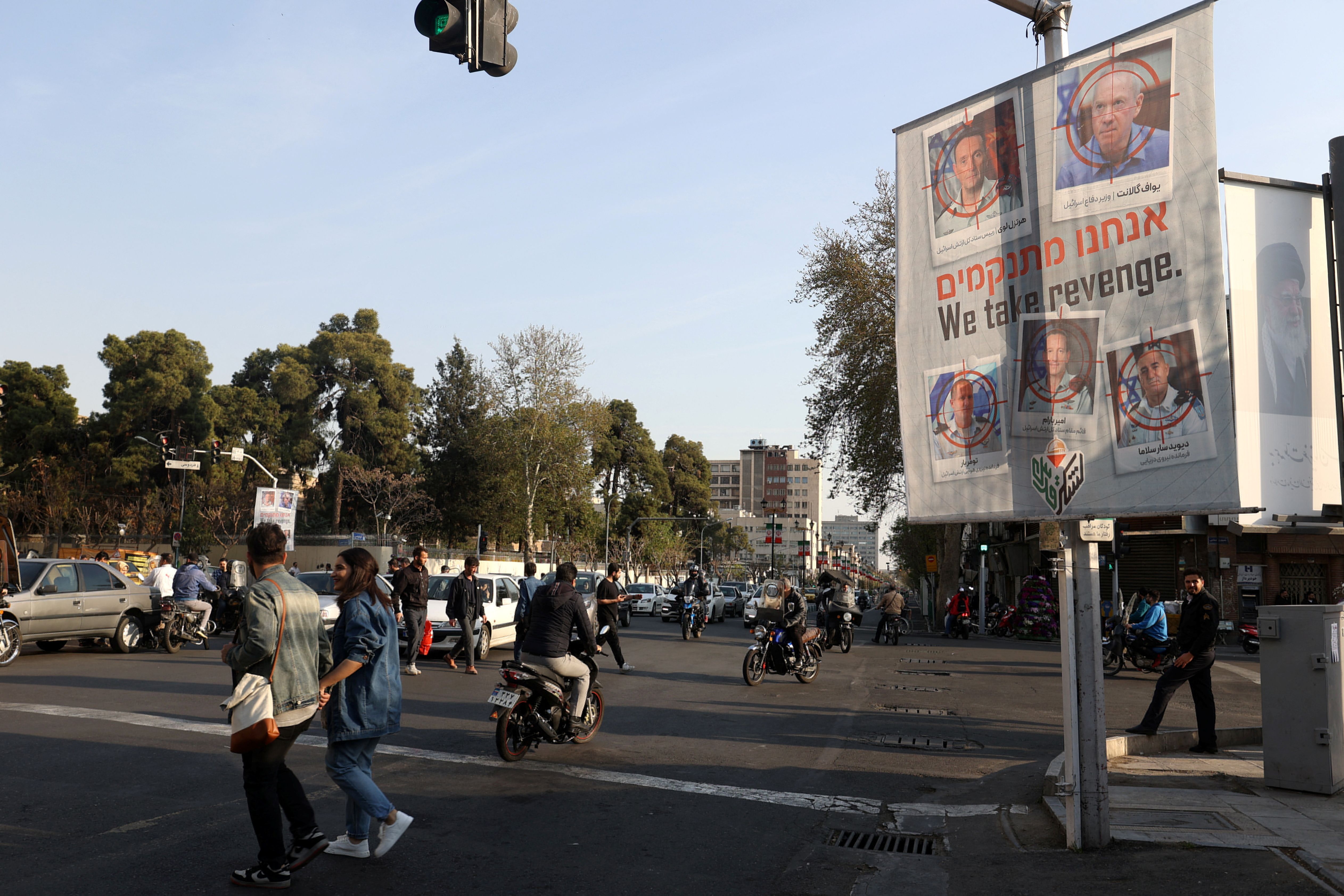 An anti-Israel banner with pictures of senior Israeli commanders that reads “We take revenge” in a street in Tehran, Iran, April 2, 2024 