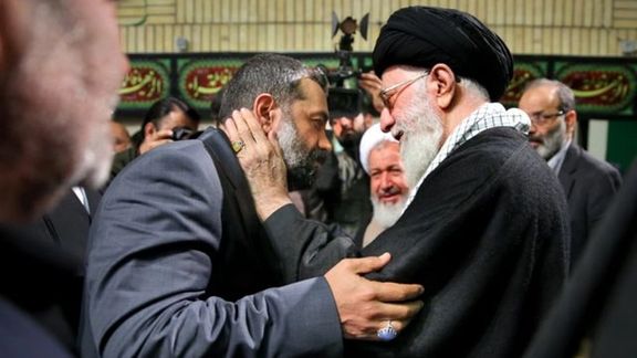 Ali Khamenei embracing his most favorite eulogist Mahmoud Karimi