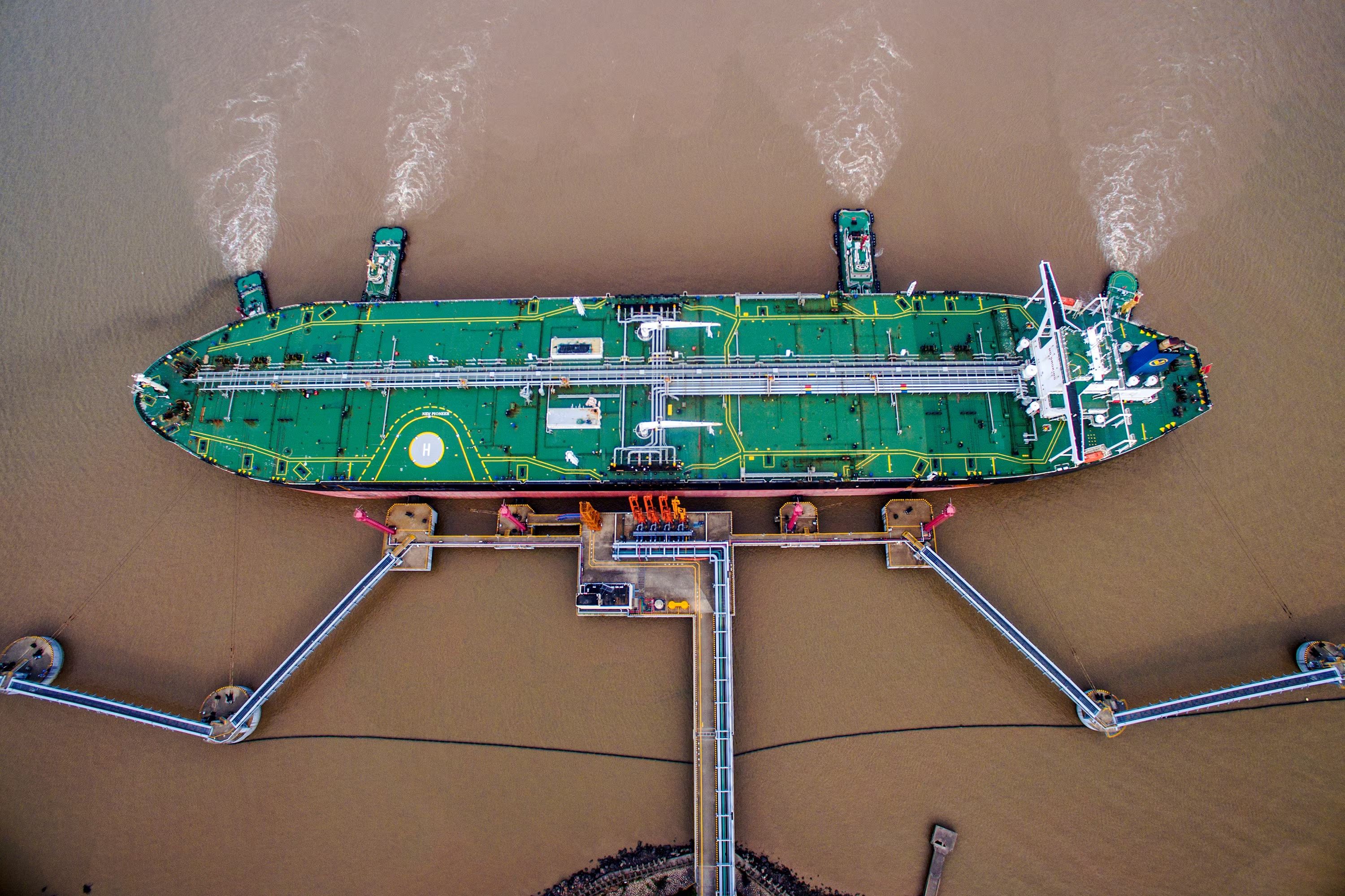 An oil tanker unloads crude oil at a crude oil terminal in Zhoushan, Zhejiang province, China July 4, 2018. 