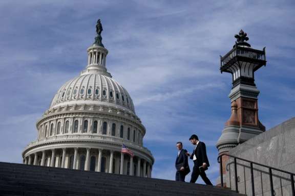 People walk past the US Capitol building in Washington, November 15, 2023.